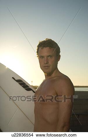 Young male surfer View Large Photo Image Picture - Young male surfer. Fotosearch