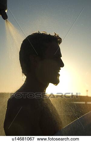 Young male surfer rinsing off in the shower View Large Photo Image Stock Photo - Young male surfer rinsing off in the shower. Fotosearch