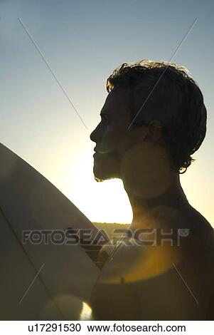 Stock Image - Young male surfer. Fotosearch