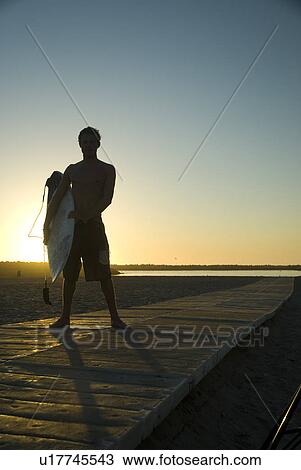 Young male surfer View Large Photo Image Stock Image - Young male surfer. Fotosearch