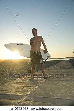 Young male surfer View Large Photo Image Stock Photo - Young male surfer. Fotosearch