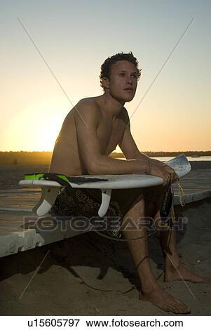 Young male surfer View Large Photo Image Stock Photo - Young male surfer. Fotosearch