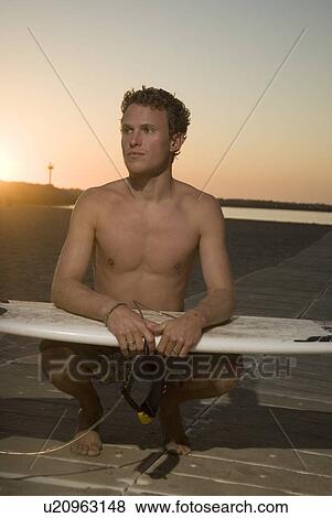 Young male surfer View Large Photo Image Stock Photo - Young male surfer. Fotosearch