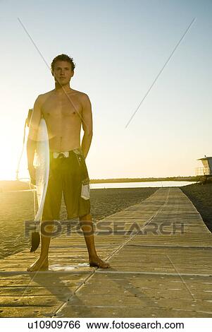 Young male surfer View Large Photo Image Stock Photograph - Young male surfer. Fotosearch