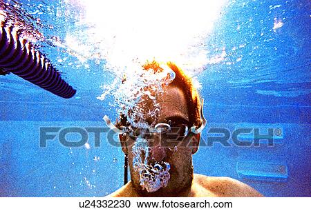 Young male swimmer under water View Large Photo Image Stock Image - Young male swimmer under water. Fotosearch