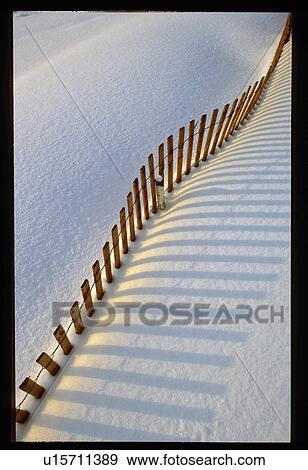 Stock Photo - Aerial view of fence in snow. Fotosearch