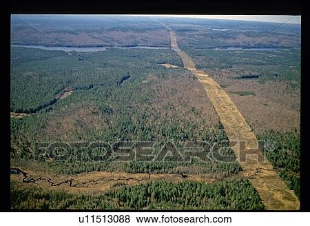 Stock Photo - Aerial view of river through forest. Fotosearch