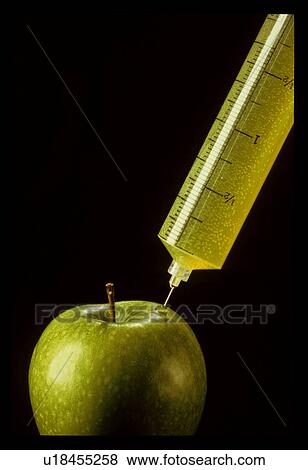 Apple being injected View Large Photo Image Stock Photo - Apple being injected. Fotosearch