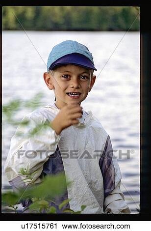 Boy by the lake View Large Photo Image Stock Image - Boy by the lake. Fotosearch