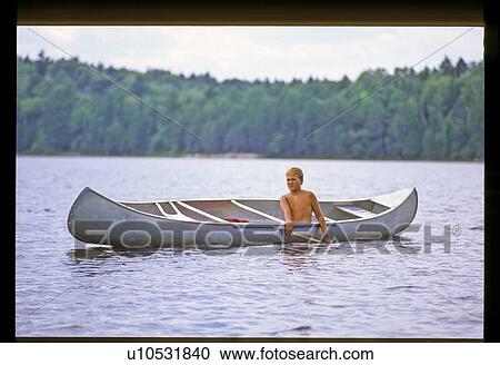 Stock Image - Boy canoeing . Fotosearch