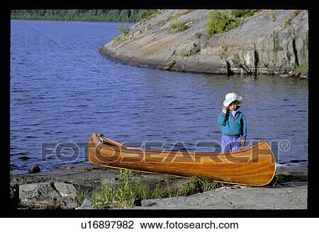 Stock Image - Boy canoeing . Fotosearch