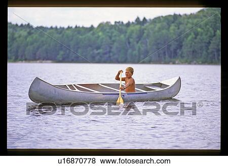 Boy canoeing View Large Photo Image Stock Photo - Boy canoeing . Fotosearch