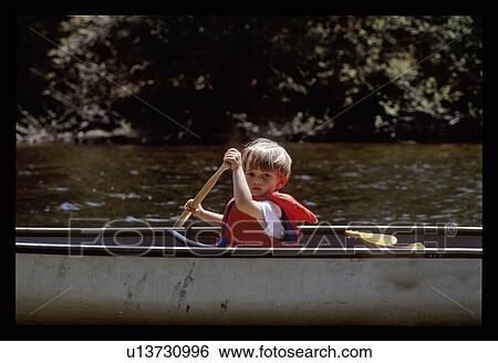 Stock Photograph - Boy canoeing . Fotosearch