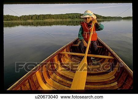 Boy in a canoe View Large Photo Image Stock Image - Boy in a canoe. Fotosearch