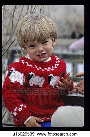 Boy in a sheep sweater View Large Photo Image Stock Photo - Boy in a sheep sweater. Fotosearch
