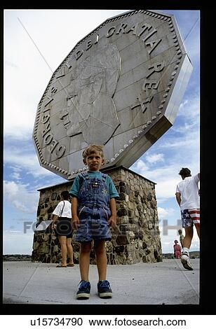 Stock Image - Boy in front of Georgivs Vi Dei Rex Monument. Fotosearch