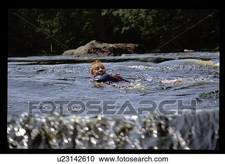 Stock Image - Boy in water. Fotosearch