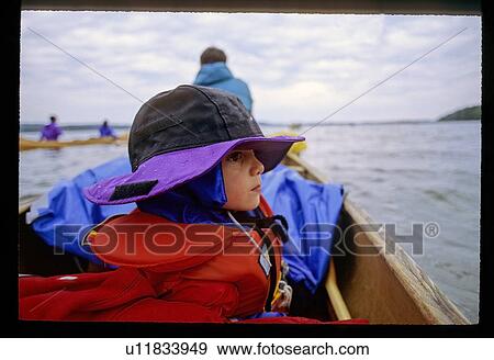 Stock Photo - Boy on a boat. Fotosearch