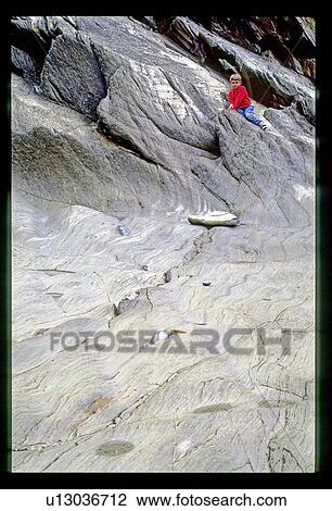 Boy on rock View Large Photo Image Stock Image - Boy on rock . Fotosearch