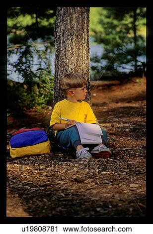 Boy studying in the forest View Large Photo Image Stock Image - Boy studying in the forest. Fotosearch