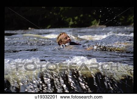 Boy swimming View Large Photo Image Stock Image - Boy swimming. Fotosearch