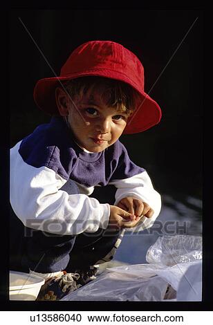 Boy with plastic bags View Large Photo Image Stock Image - Boy with plastic bags. Fotosearch