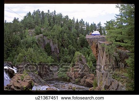 Stock Image - Camping on a rock. Fotosearch