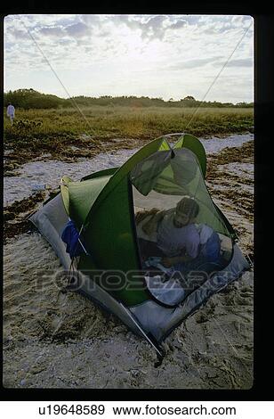Camping on the beach View Large Photo Image Stock Photo - Camping on the beach. Fotosearch