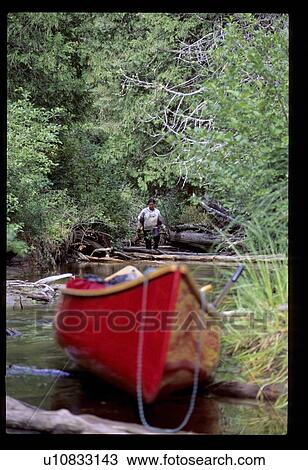 Canoe in the water View Large Photo Image Stock Image - Canoe in the water. Fotosearch