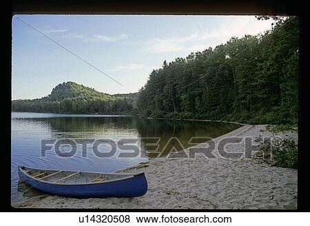 Stock Photo - Canoe on a shore. Fotosearch