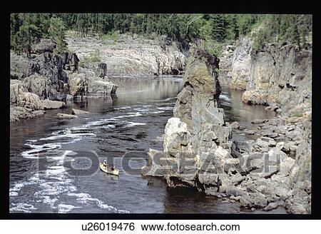Stock Photograph - Canoe on river. Fotosearch