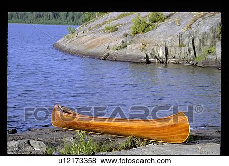 Stock Photo - Canoe on the shore. Fotosearch