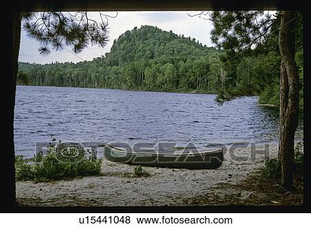 Stock Photo - Canoe on the shore. Fotosearch
