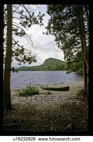 Stock Photograph - Canoe shoreline . Fotosearch