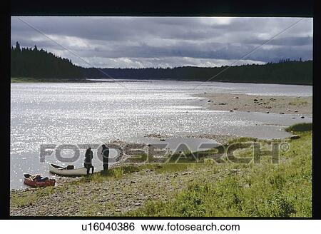 Stock Photograph - Canoeing after a storm . Fotosearch