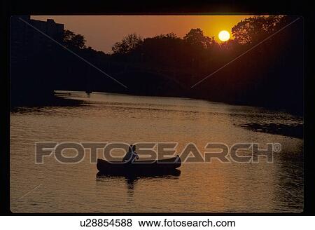 Canoeing at sunset View Large Photo Image Stock Photo - Canoeing at sunset. Fotosearch