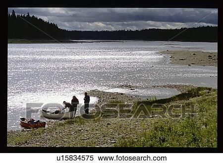 Stock Photography - Canoeing before the storm. Fotosearch