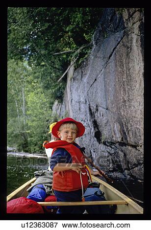 Stock Photo - Canoeing boy. Fotosearch