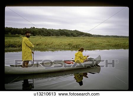 Canoeing couple View Large Photo Image Stock Image - Canoeing couple. Fotosearch