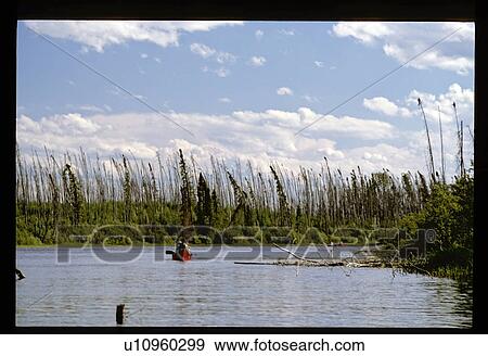 Stock Photo - Canoeing down a river. Fotosearch