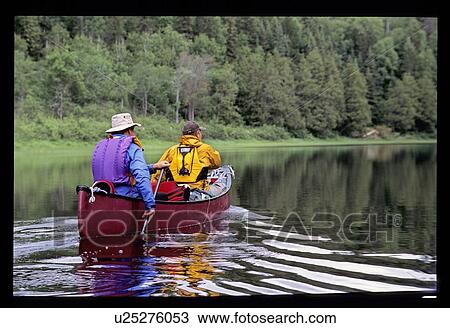 Stock Image - Canoeing down the river. Fotosearch