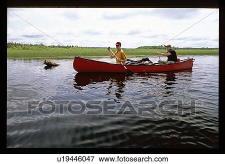 Canoeing down the river View Large Photo Image Stock Photo - Canoeing down the river. Fotosearch