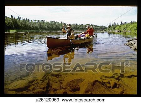Stock Photo - Canoeing down the river. Fotosearch