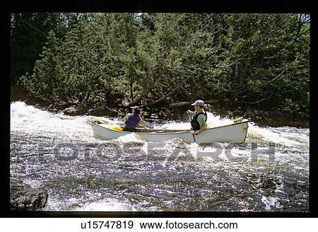 Stock Photo - Canoeing in the rapids. Fotosearch