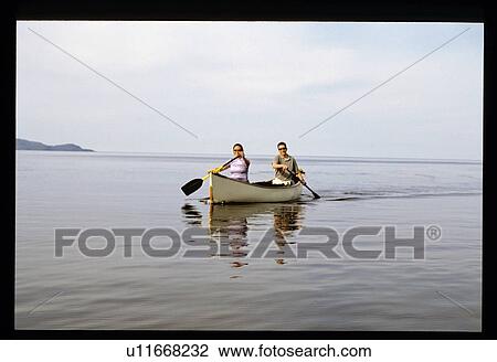 Canoeing on lake View Large Photo Image Stock Image - Canoeing on lake. Fotosearch