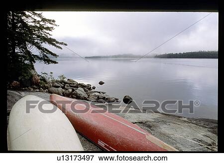 Canoes on the beach View Large Photo Image Stock Photo - Canoes on the beach. Fotosearch