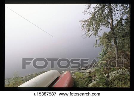 Stock Photo - Canoes on the shore. Fotosearch