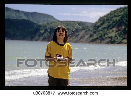 Stock Photo - Child flying a kite. Fotosearch