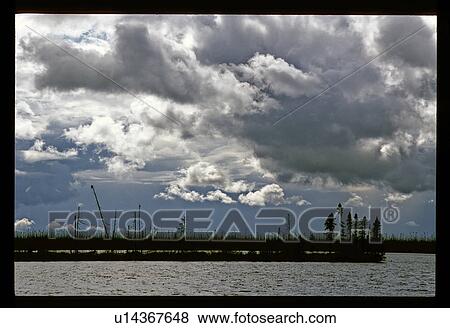 Stock Photo - Clouds over a lake. Fotosearch