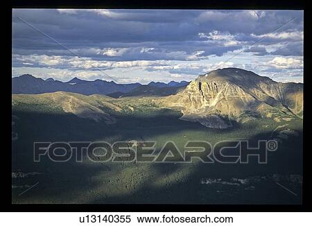 Cloudy sky over mountains View Large Photo Image Stock Photography - Cloudy sky over mountains. Fotosearch